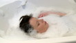 Relaxed woman having a bath at home