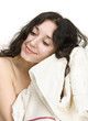 Young woman drying her hair with a towel