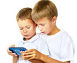 brothers playing handheld game console brothers playing handheld game console