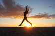 Beautiful Woman on the Beach at Sunset