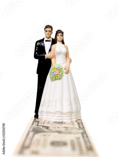 Photo: Wedding couple standing on a Dollar Bank Note Wedding couple standing on a Dollar Bank Note