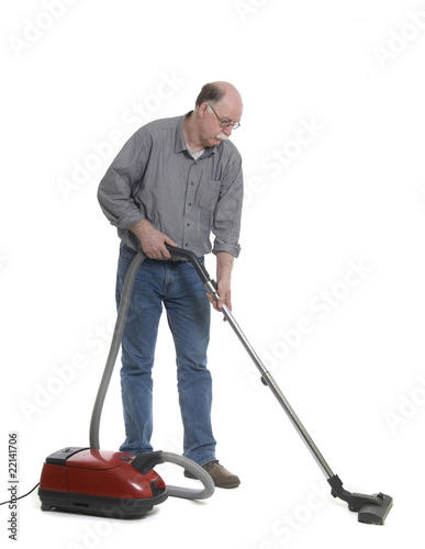 Photo: Man is using a vacuum cleaner isolated on white Man is using a vacuum cleaner isolated on white