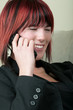 Young woman laughing on the phone Young woman laughing on the phone