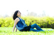 Young happy girl lying on grass Young happy girl lying on grass