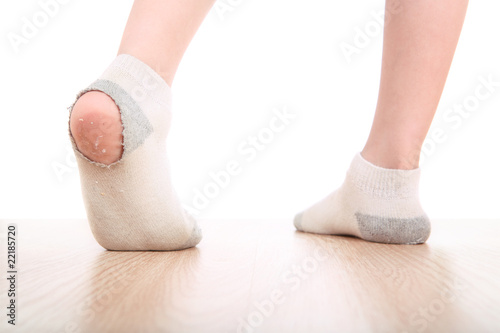 Photo: Boy wearing dirty socks with holes in them Boy wearing dirty socks with holes in them