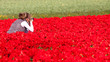 Girl making pictures of flowers
