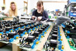 women populating electronic assemblies