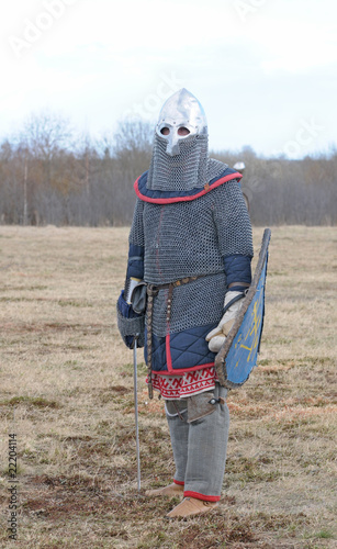 Photo: The medieval pedestrian soldier in an armour and with the weapon The medieval pedestrian soldier in an armour and with the weapon