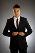 businessman buttons up