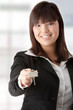 Beautiful woman holding keys and moneys Beautiful woman holding keys and moneys