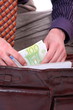 Man is paying with euro banknotes Man is paying with euro banknotes