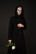 Two-faced witch holding the rose