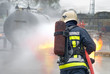 Firefighter extinguishing tank fire Firefighter extinguishing tank fire