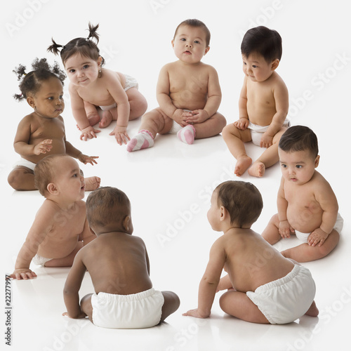 Photo: Studio shot of babies sitting in circle Studio shot of babies sitting in circle