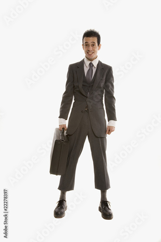 Foto: Hispanic businessman wearing suit that is too small Hispanic businessman wearing suit that is too small