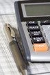 Balancing the Accounts. Calculator, pen