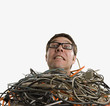 Studio shot of technician buried in computer cables