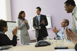 Businesswoman receiving plaque