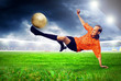 Happiness football player after goal on the field of stadium wit