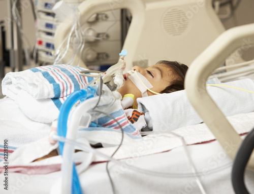 Photo: Hispanic boy in Intensive Care Unit bed Hispanic boy in Intensive Care Unit bed
