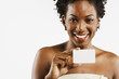 African American woman holding blank card