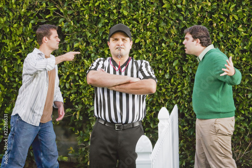 Photo: Hispanic referee between arguing neighbors Hispanic referee between arguing neighbors