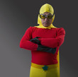 Mixed Race male super hero with arms crossed