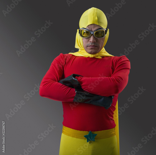 Photo: Mixed Race male super hero with arms crossed Mixed Race male super hero with arms crossed