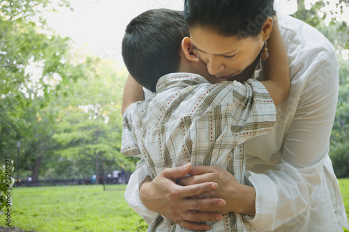 Photo: Hispanic mother and son hugging Hispanic mother and son hugging