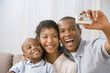 African American family taking own photograph