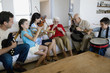 Multi-generational Hispanic family playing musical instruments