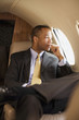 African American businessman on airplane