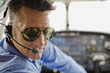 Man in cockpit of airplane