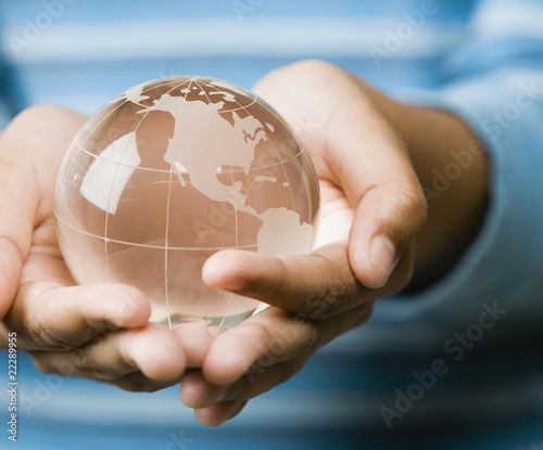 Photo: Mixed Race girl holding globe Mixed Race girl holding globe