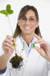 Maltese female scientist holding plant and medication