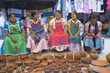 Group of indigenous Mexican women selling pottery