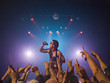 Male rock star performing in front of audience