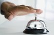 Mixed Race man ringing service bell