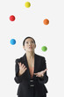 Asian businesswoman juggling
