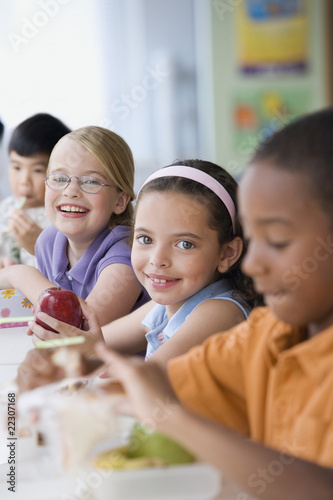 Photo: Students eating healthy lunch in cafeteria Students eating healthy lunch in cafeteria