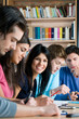 Happy students in college library