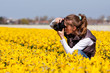 Photo: Girl making pictures of flowers Girl making pictures of flowers