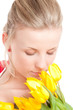 Young woman with bunch of tulips