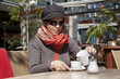 Photo: Caucasian young woman enjoying a coffee break Caucasian young woman enjoying a coffee break