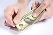 Dollars in hands, paying money