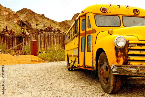 Photo: Old rusty school bus abondoned in desert Old rusty school bus abondoned in desert