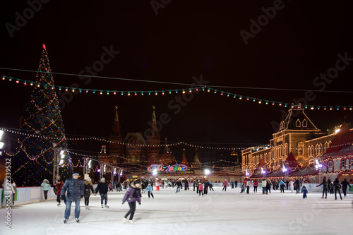 Photo: skating-rink on red square in moscow at night. GUM trading house skating-rink on red square in moscow at night. GUM trading house