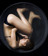 Woman curled up in a fetal position