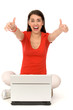 Girl with thumbs up using laptop