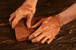 artist man hands working red clay for handcraft artist man hands working red clay for handcraft